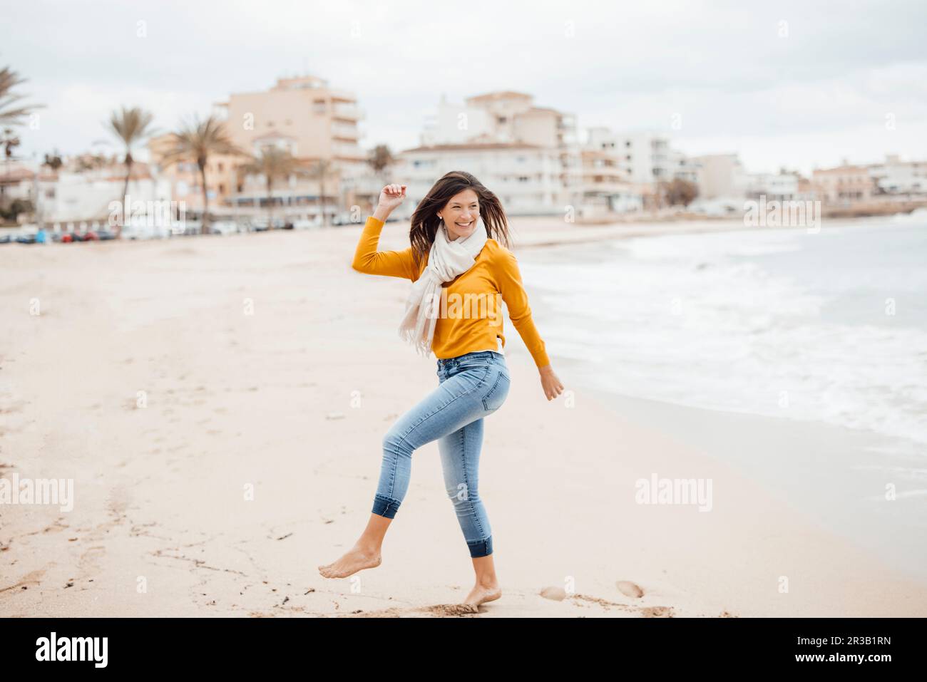 Woman dancing scarf on beach hi-res stock photography and images - Alamy