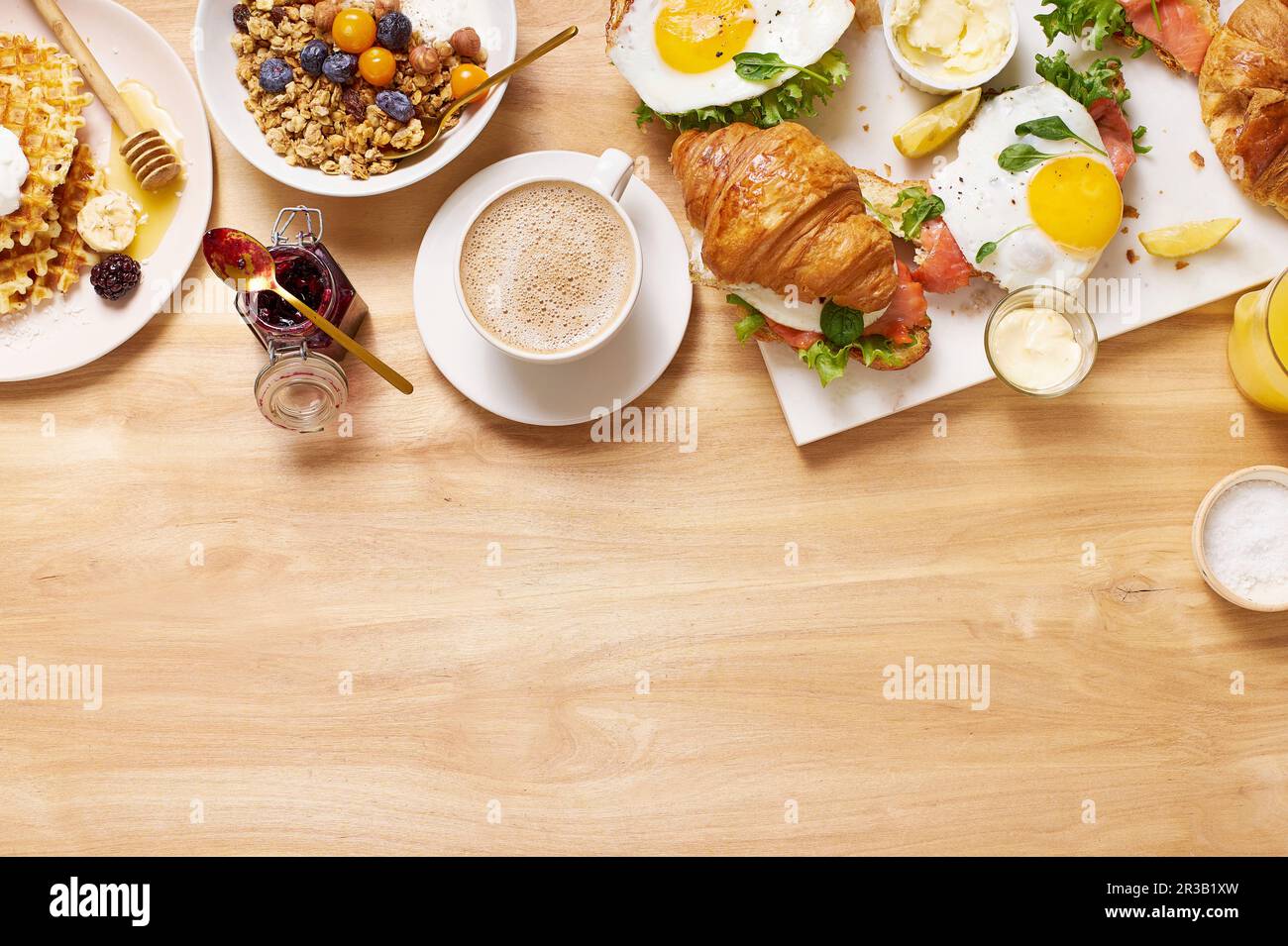 healthy-sunday-breakfast-with-croissants-waffles-granola-and