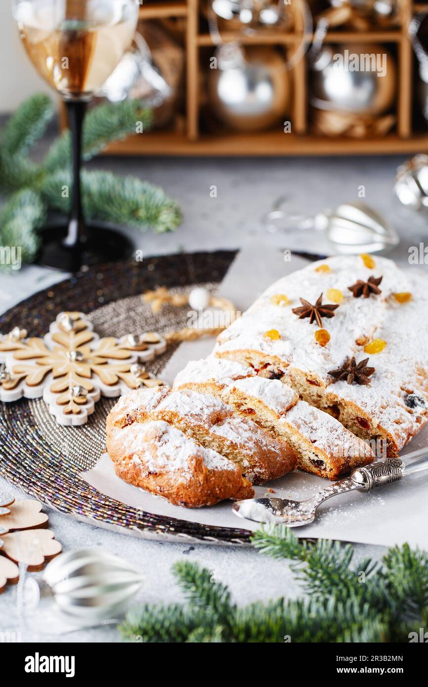 Holiday baking. Christmas cake. Stollen is fruit bread of nuts, spices, dried or candied fruit, coat Stock Photo