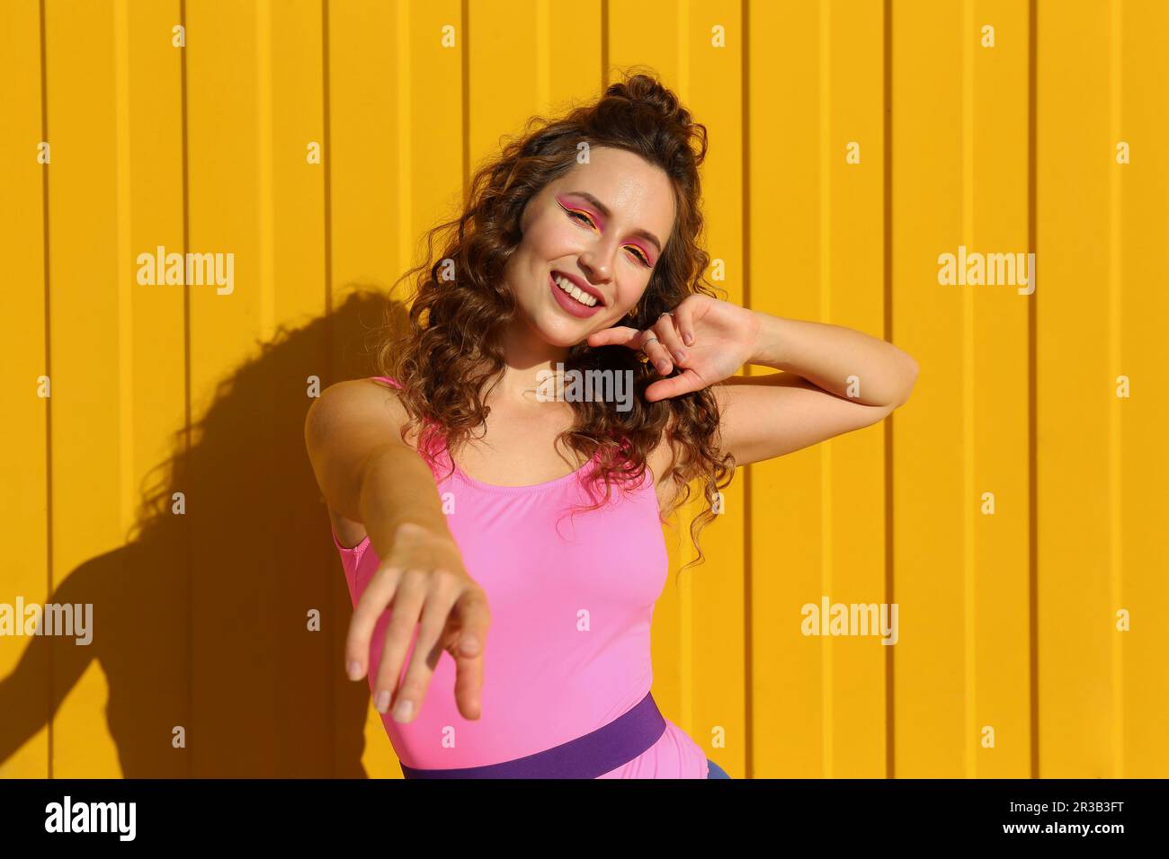 Dancing woman in yellow front hi-res stock photography and images - Alamy