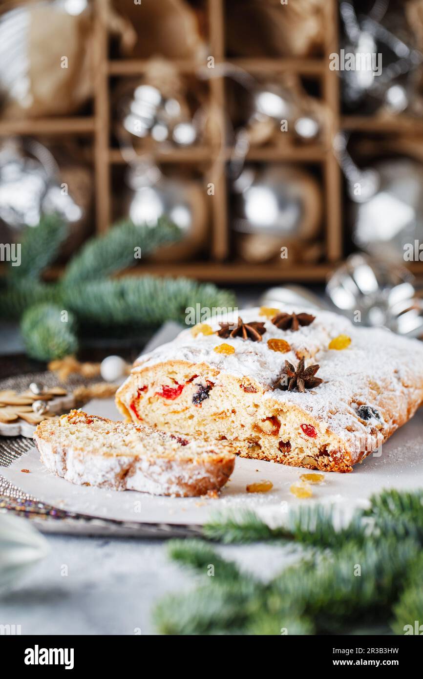 Holiday baking. Christmas cake. Stollen is fruit bread of nuts, spices, dried or candied fruit, coat Stock Photo