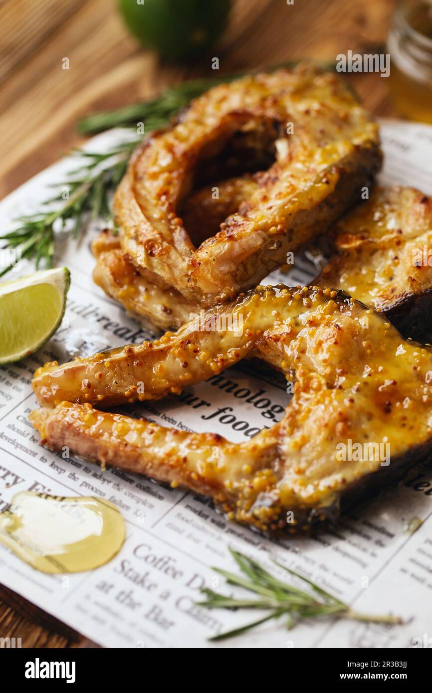 Carp baked in honey mustard sauce. Fried Slices of Big River Fish. Battered fish Stock Photo Alamy