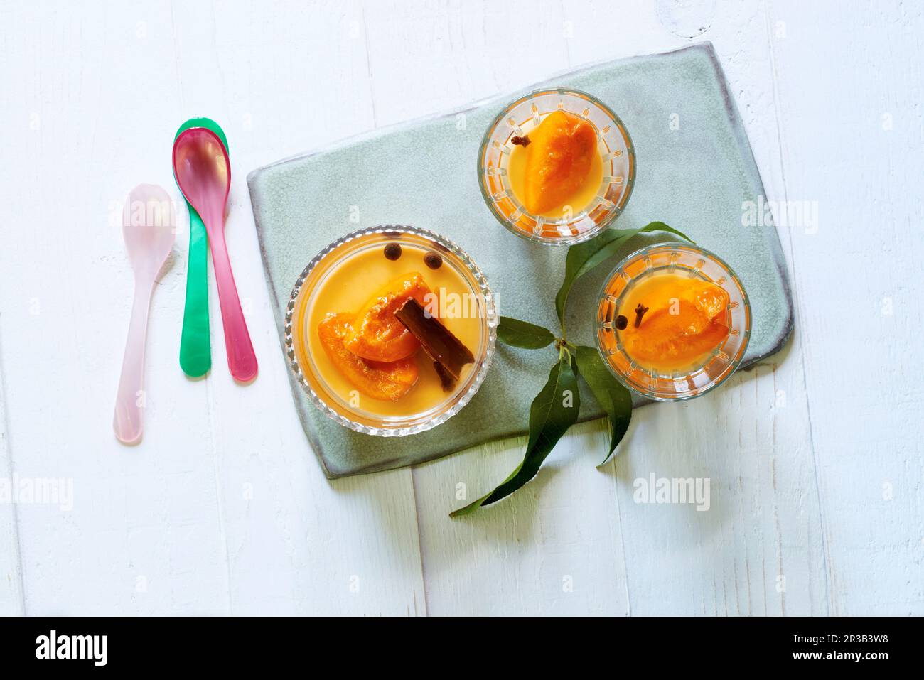 Charred honey panna cotta with apricot compote Stock Photo Alamy