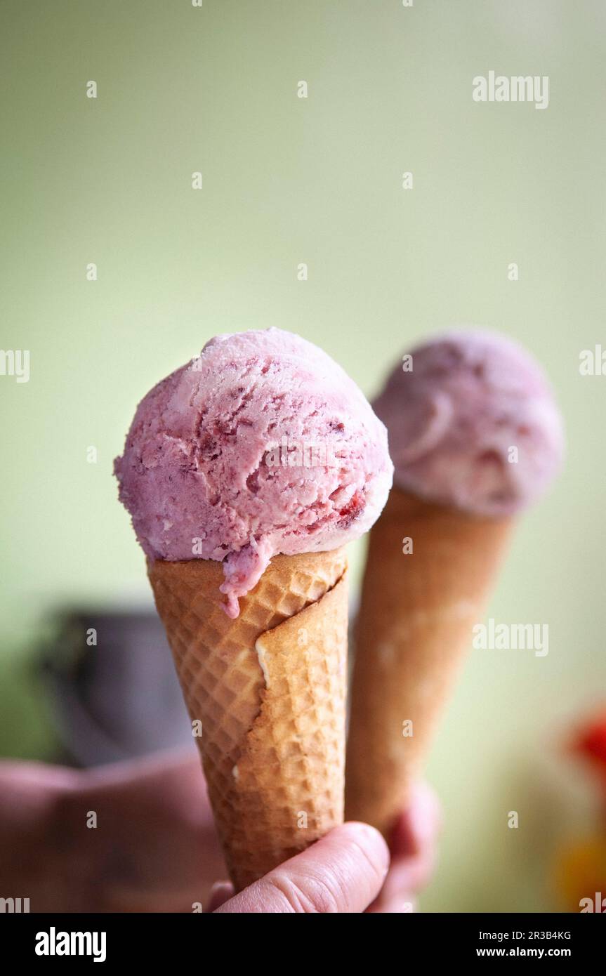 Berry yoghurt ice cream in a cone Stock Photo Alamy
