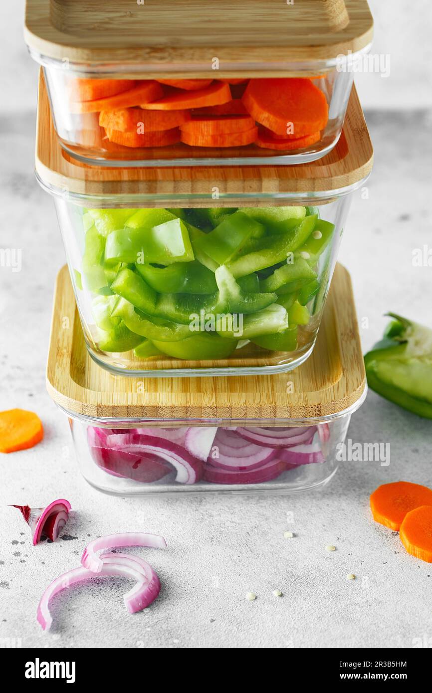 Glass boxes with fresh raw vegetables. Healthy Meal Prep - recipe preparation photos. Healthy vegan Stock Photo