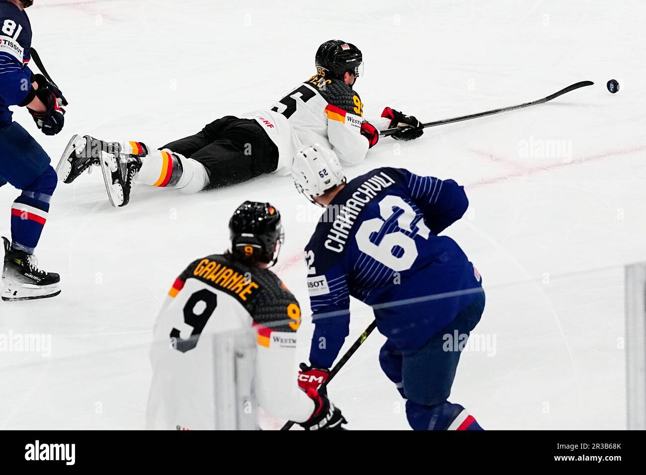 Germany's Frederik Tiffels, top, battles for the puck during the group