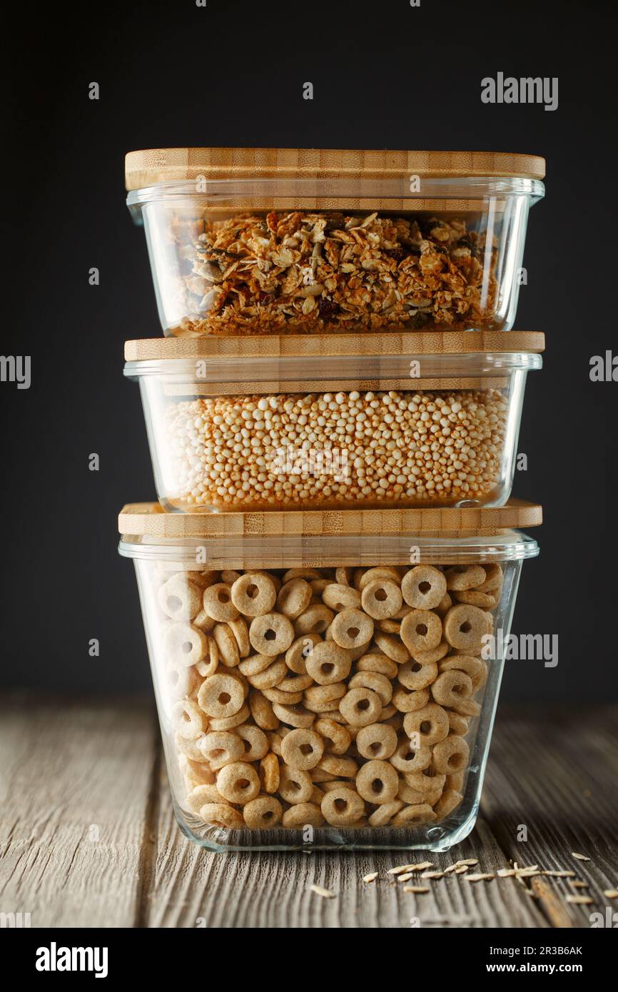 Breakfast cereal. Glass boxes with granola, cereal rings and Quinoa