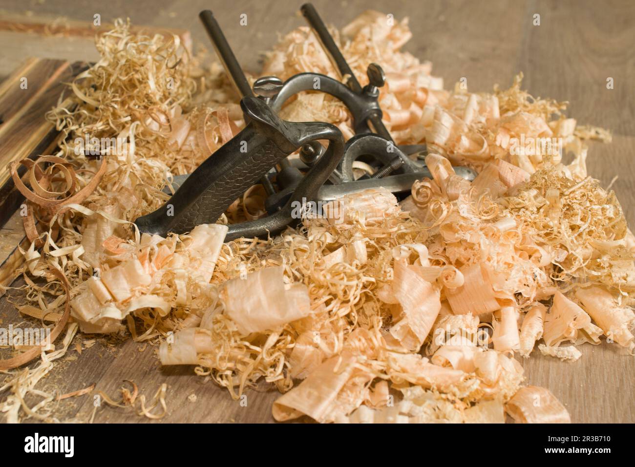 Combination plane and a pile of pine shavings. Woodworking by hand