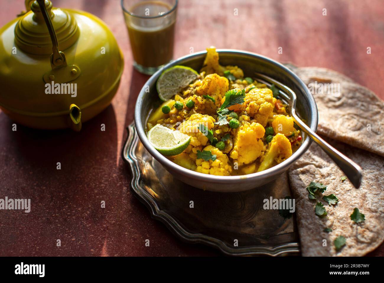 Indian cauliflower tumeric curry with chapati Stock Photo Alamy