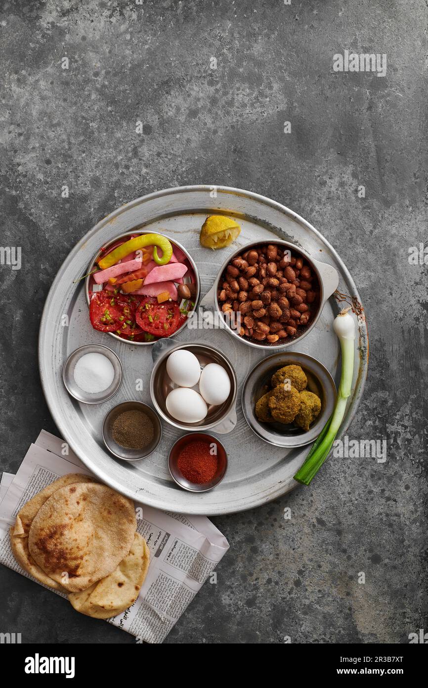 Traditional Egyptian breakfast variations, Foul and falafel with pickled tomatoes Stock Photo