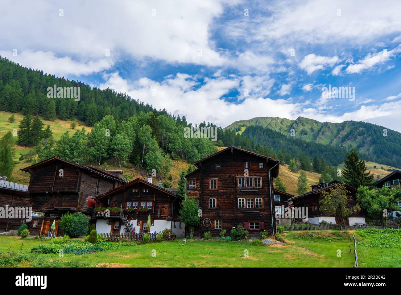 Ancient wooden traditional Swiss granaries and chalets on stone piles in an old abandoned village in Switzerland in mountains Stock Photo