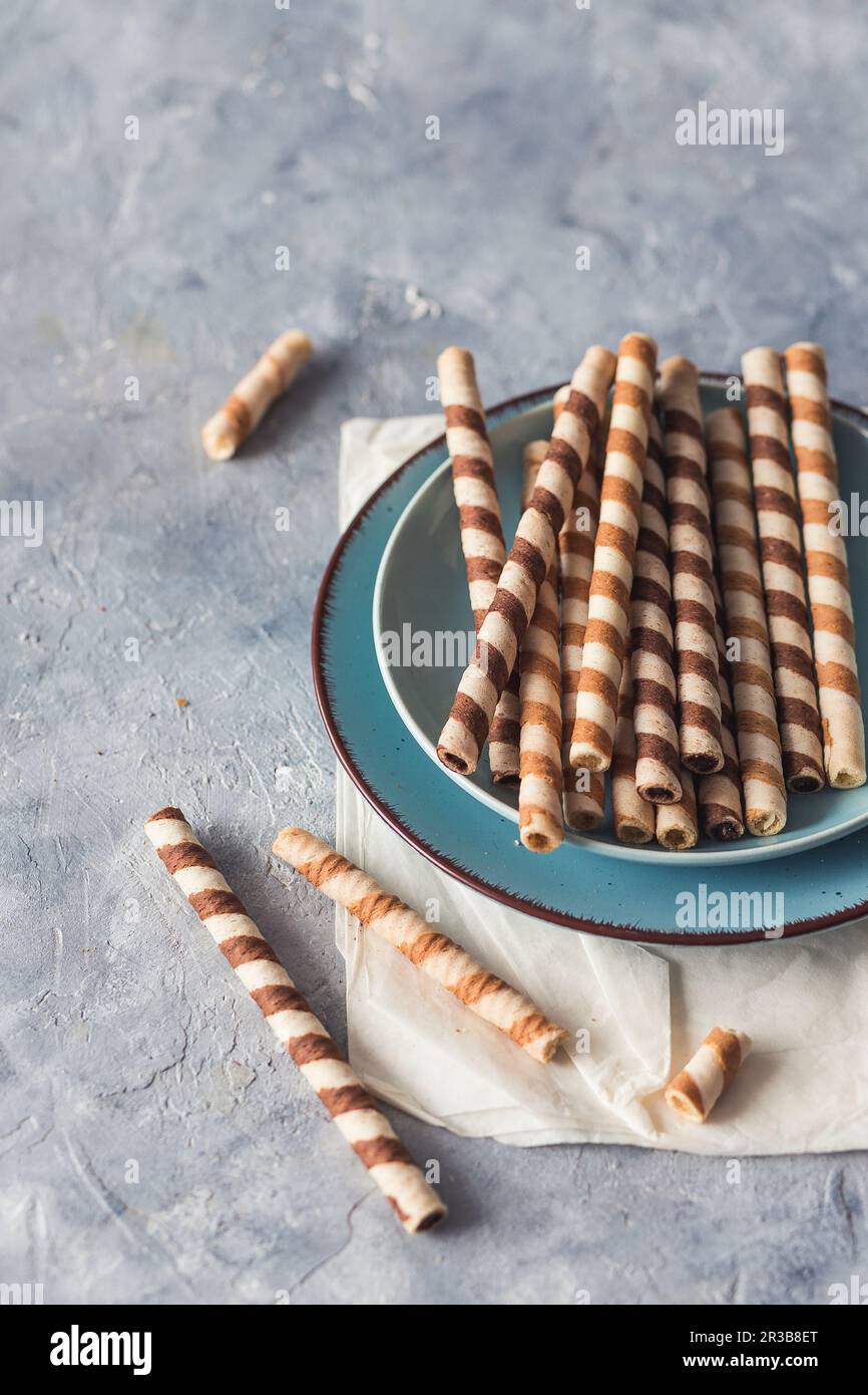 Wafer roll cookies on a plate Stock Photo Alamy