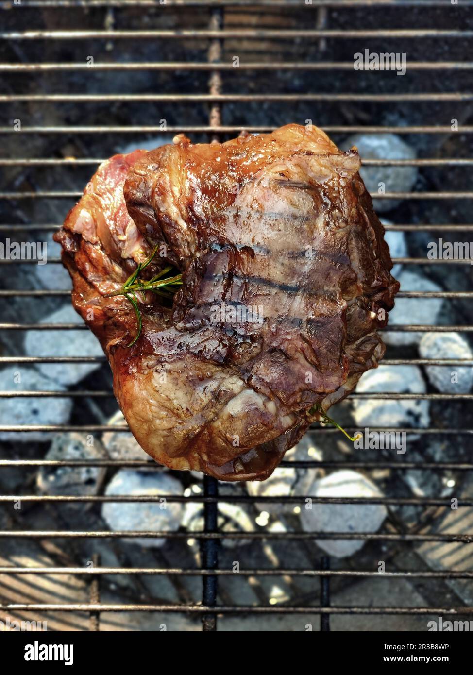 Grilled leg of lamb on a grill rack Stock Photo - Alamy