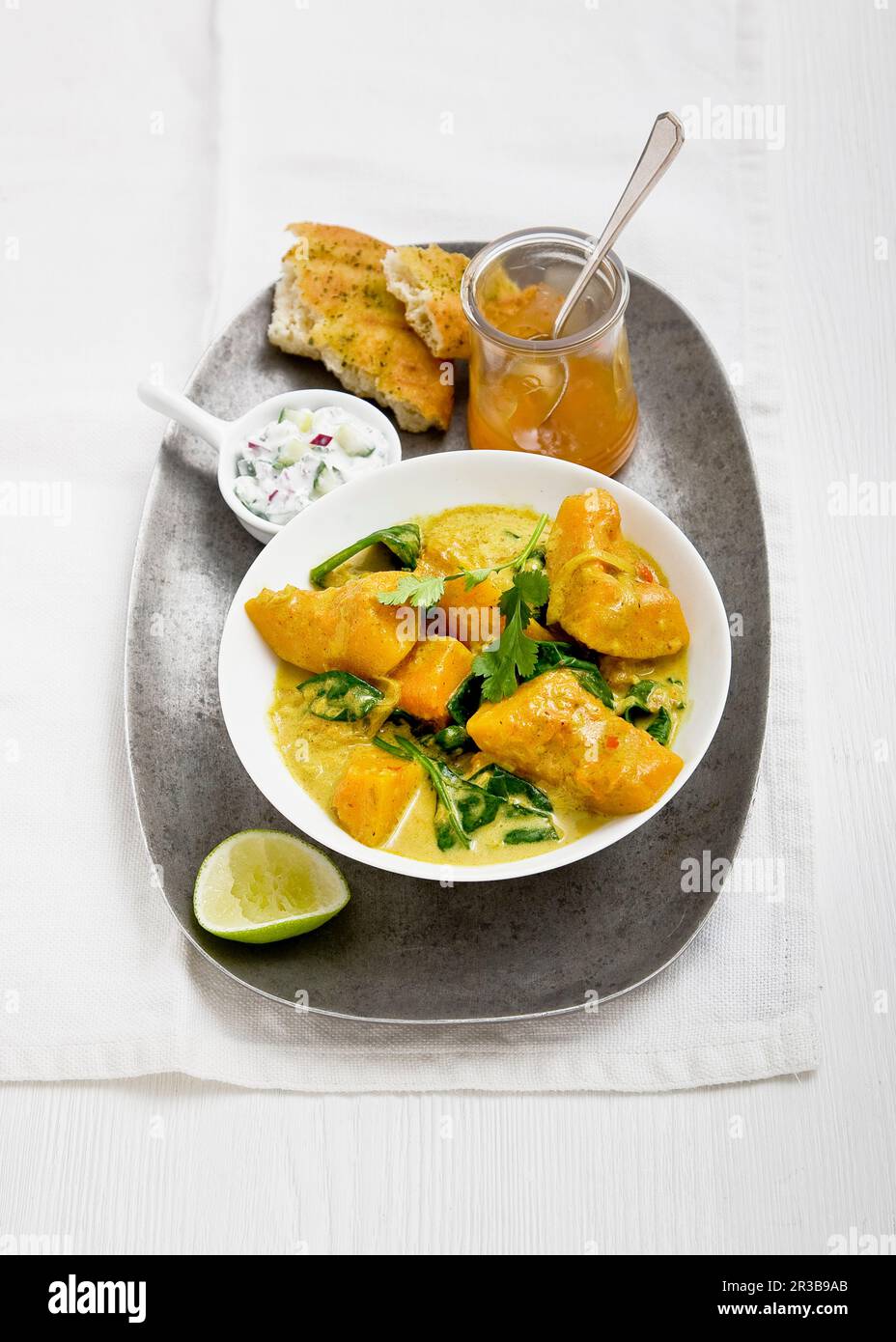 Sweet potato and spinach curry with coconut milk and coriander Stock