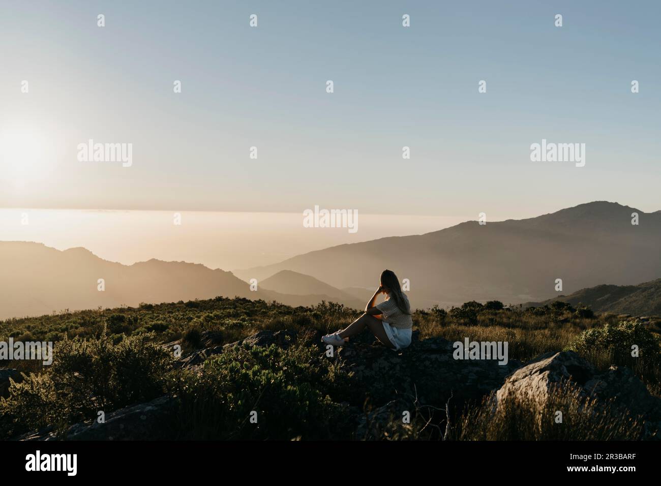 Woman admiring sunset view hi-res stock photography and images - Alamy