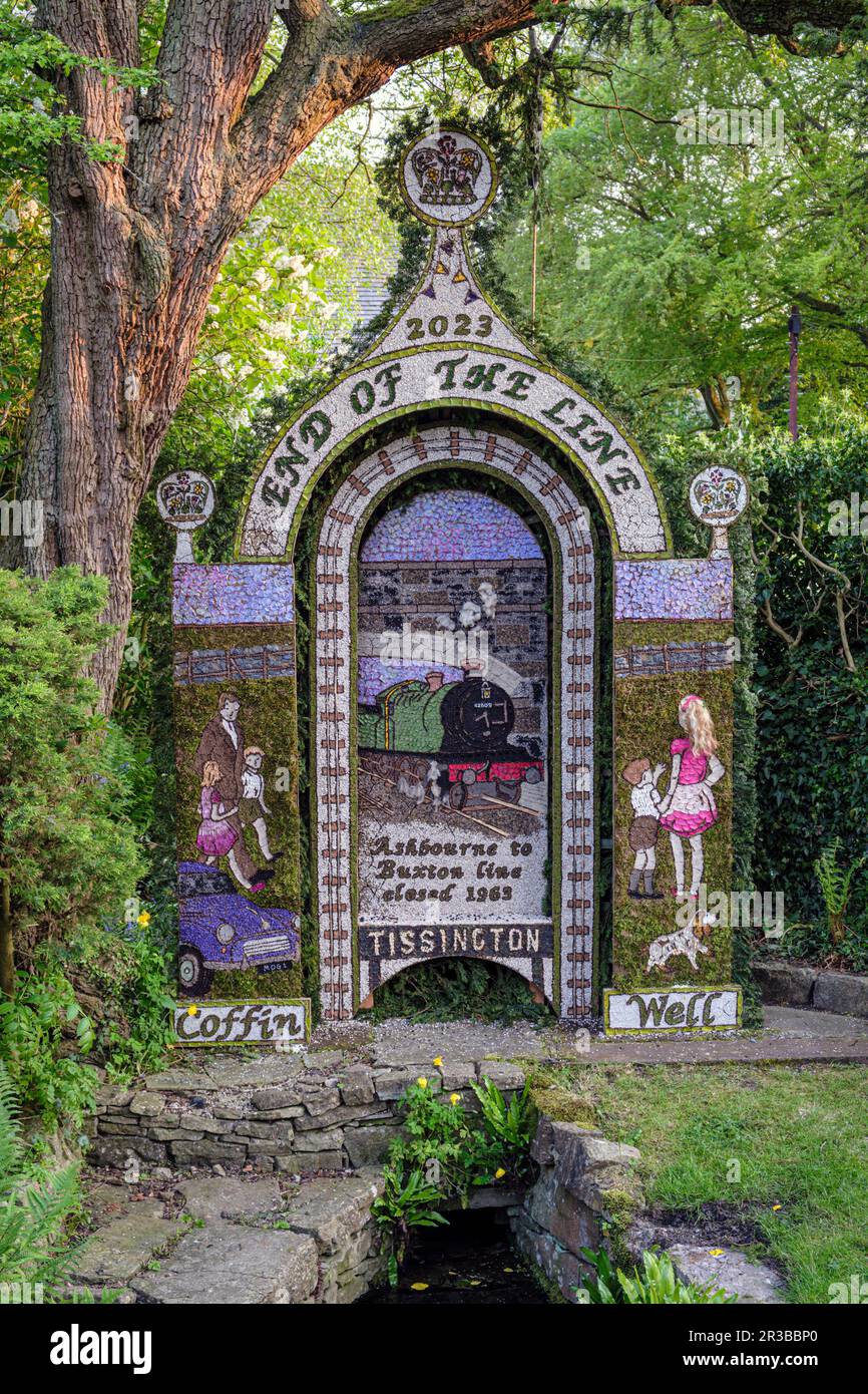 Tissington Well Dressing, 2023 - the Coffin Well with a theme celebrating the Ashbourne to Buxton railway line which closed in 1963 Stock Photo