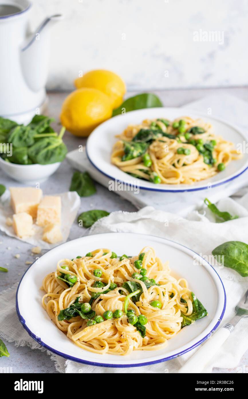 Pasta with spinach, peas and lemon Stock Photo Alamy