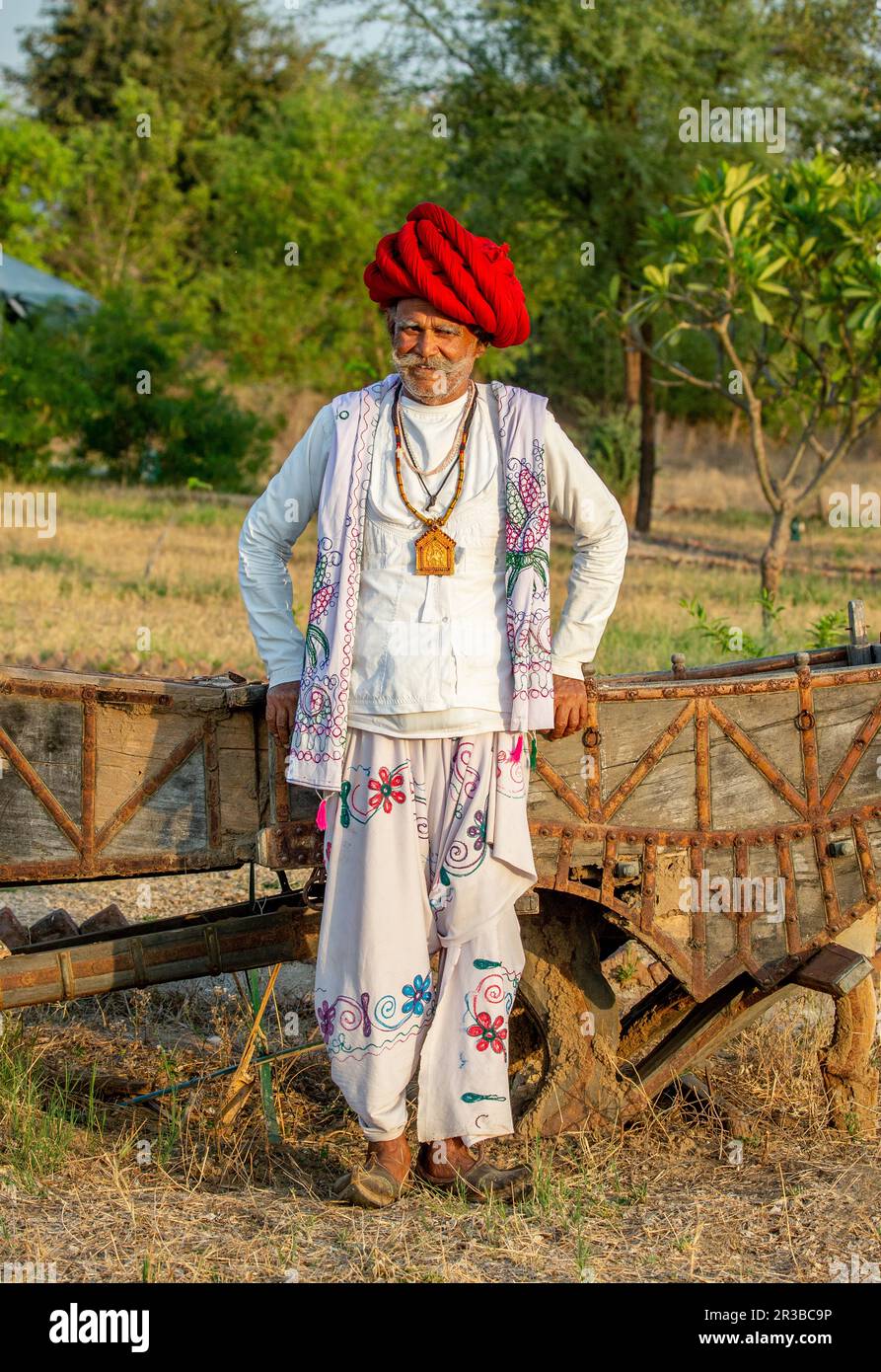 Portrait of a man of the Rabari ethnic group in a national headdress and traditional dress with national ornaments. Stock Photo