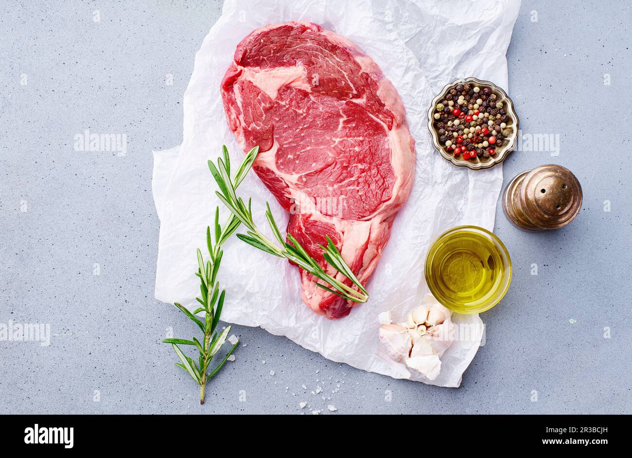 Black Angus prime beef chuck roll steak with fresh rosemary, thyme