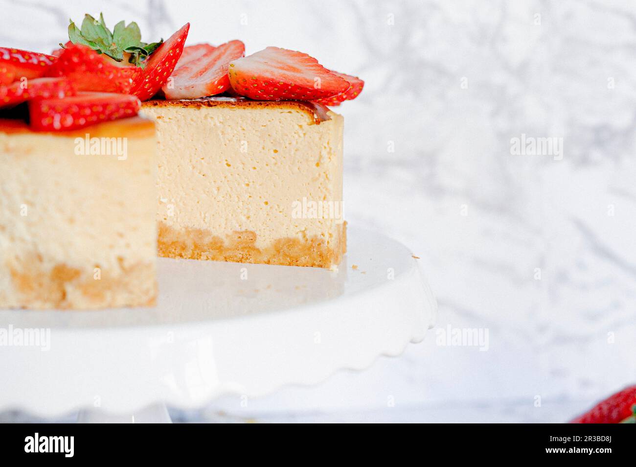 Amarula cream cheese cake with strawberries, sliced Stock Photo Alamy