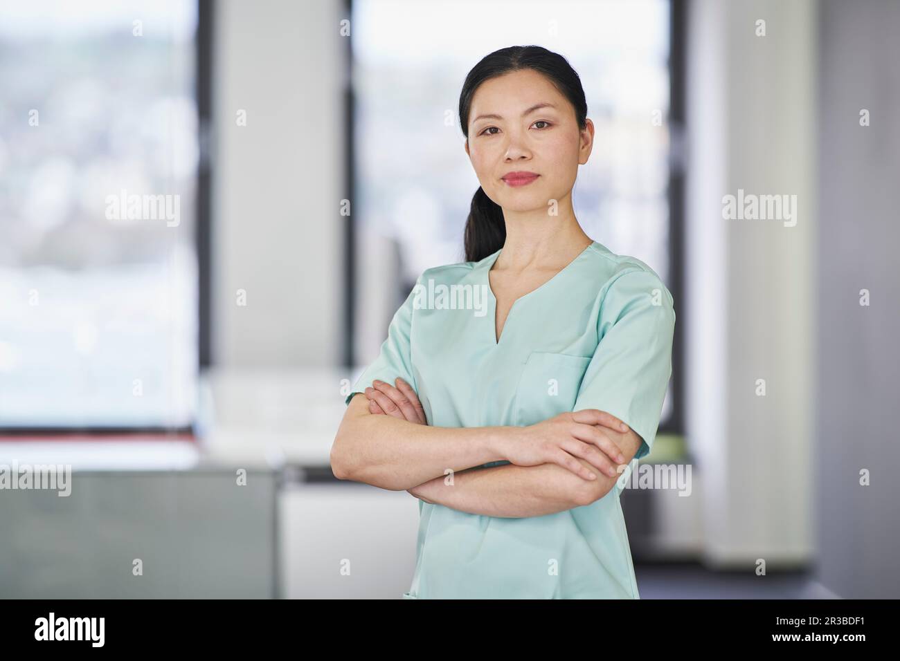An asian nurse in scrubs hi-res stock photography and images - Alamy