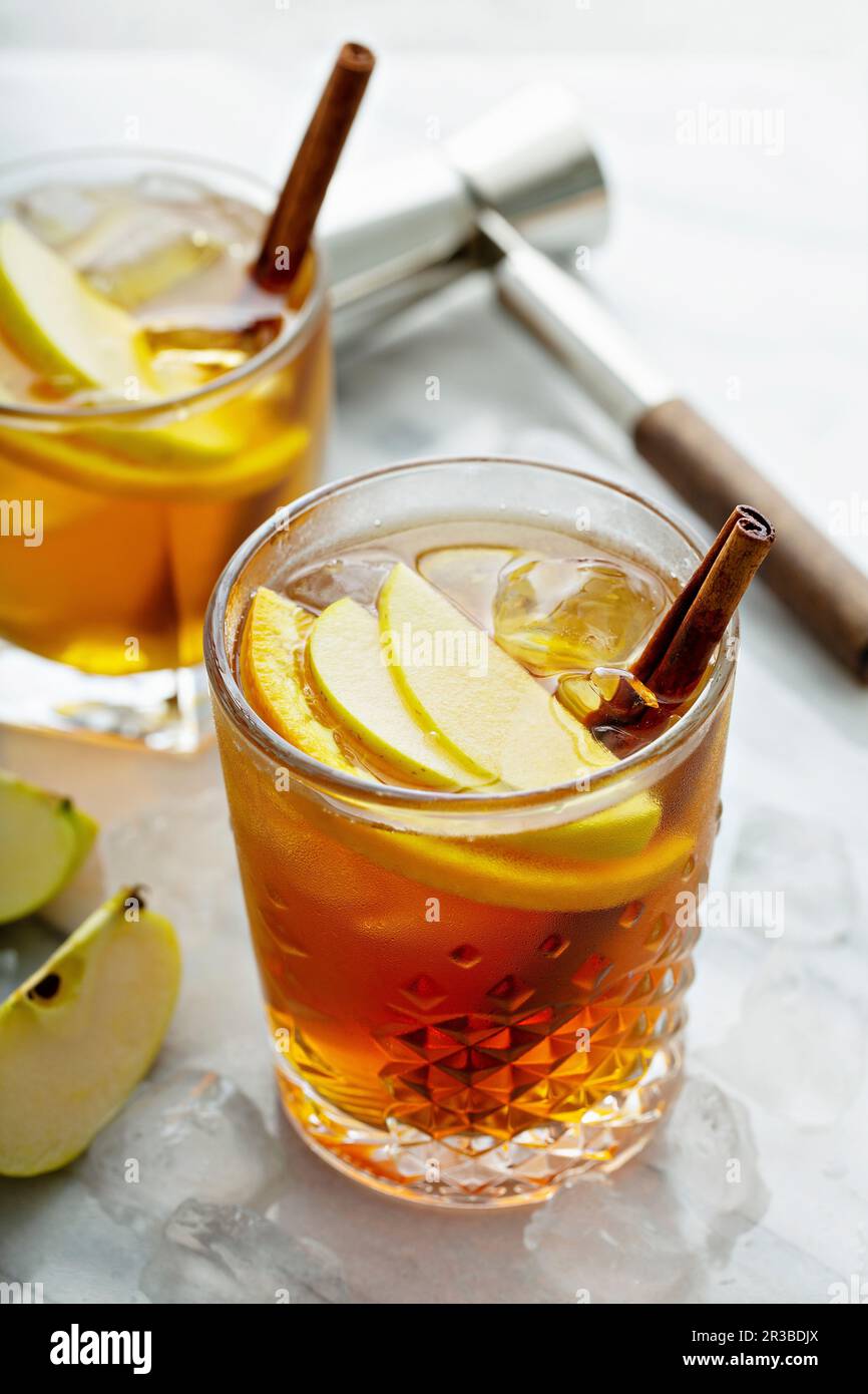 Apple cider old fashioned cocktail with cinnamon Stock Photo