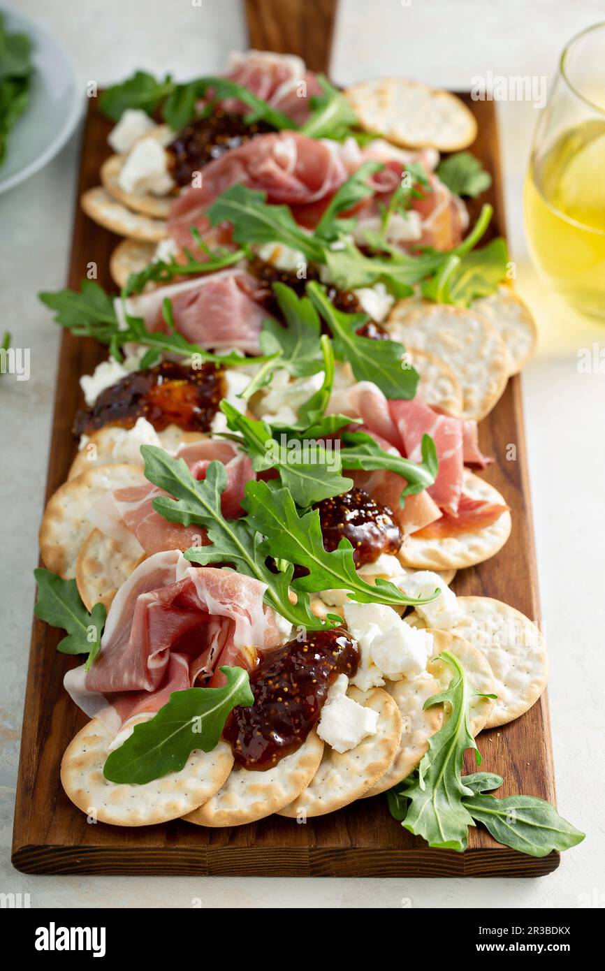 Goat cheese, prosciutto and fig jam snack board Stock Photo Alamy