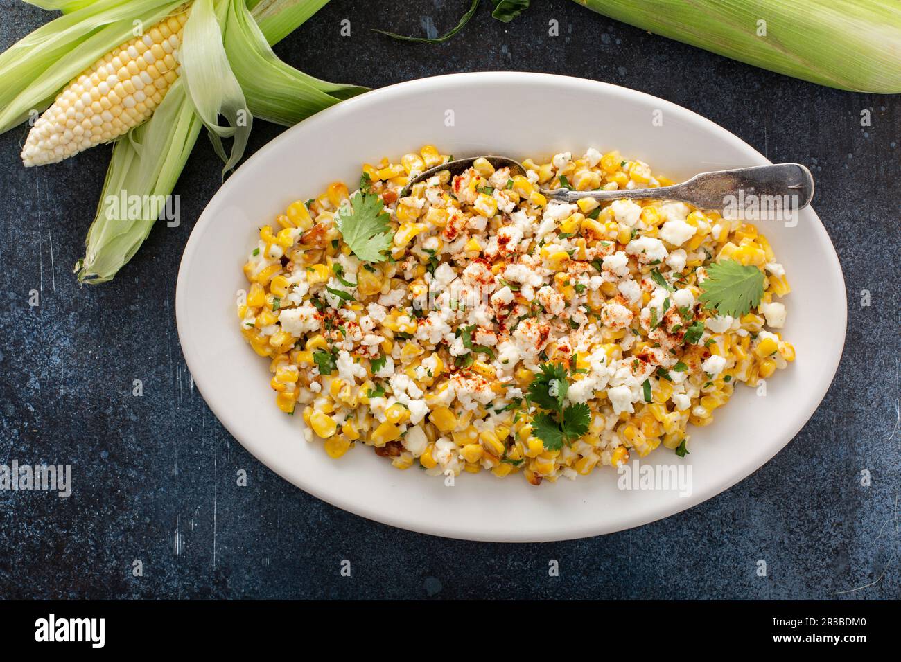 Mexican street corn, elote with cotija cheese, fresh cilantro and chili
