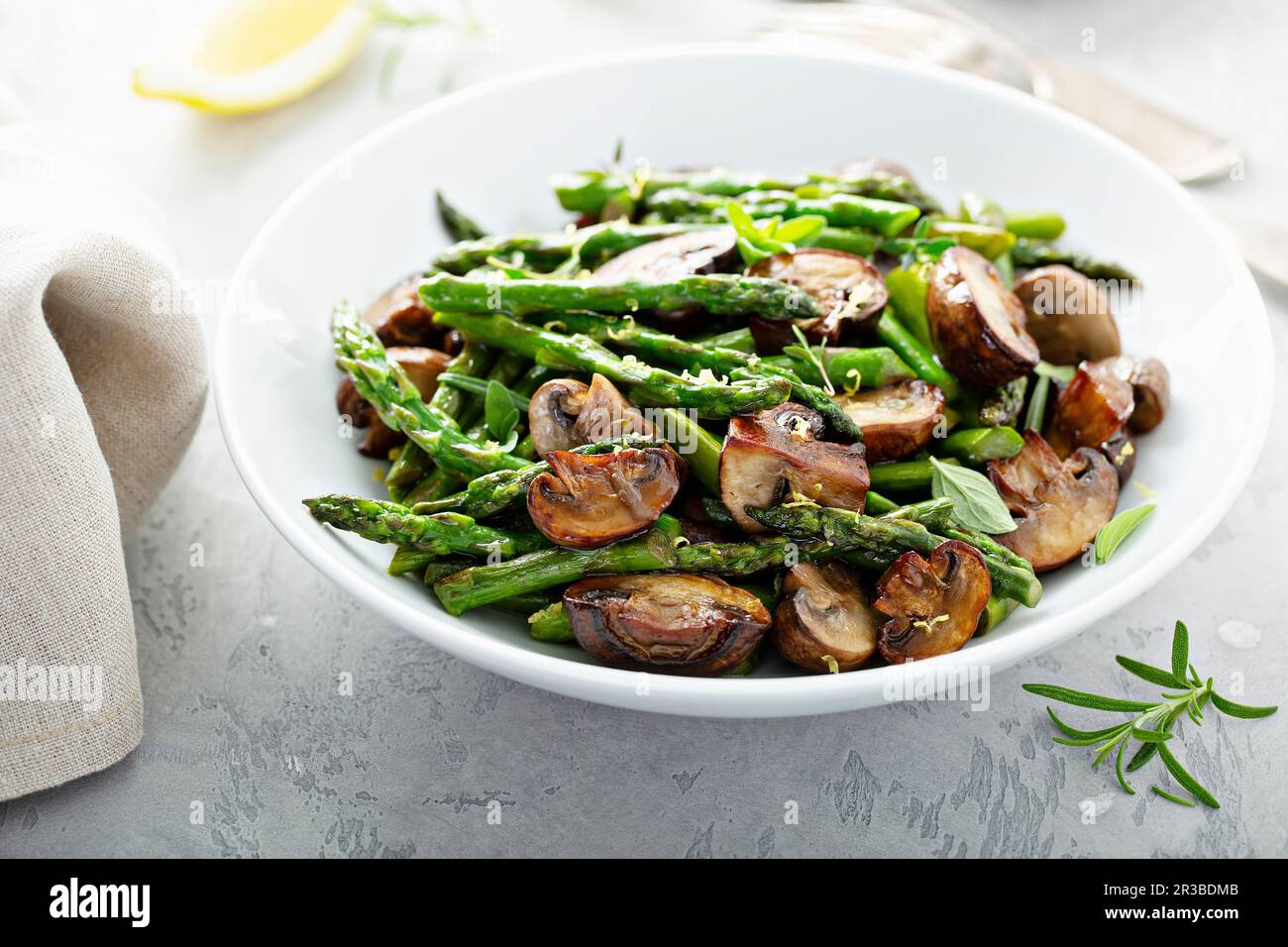 Sauteed mushrooms, asparagus, lemon zest and herbs Stock Photo Alamy
