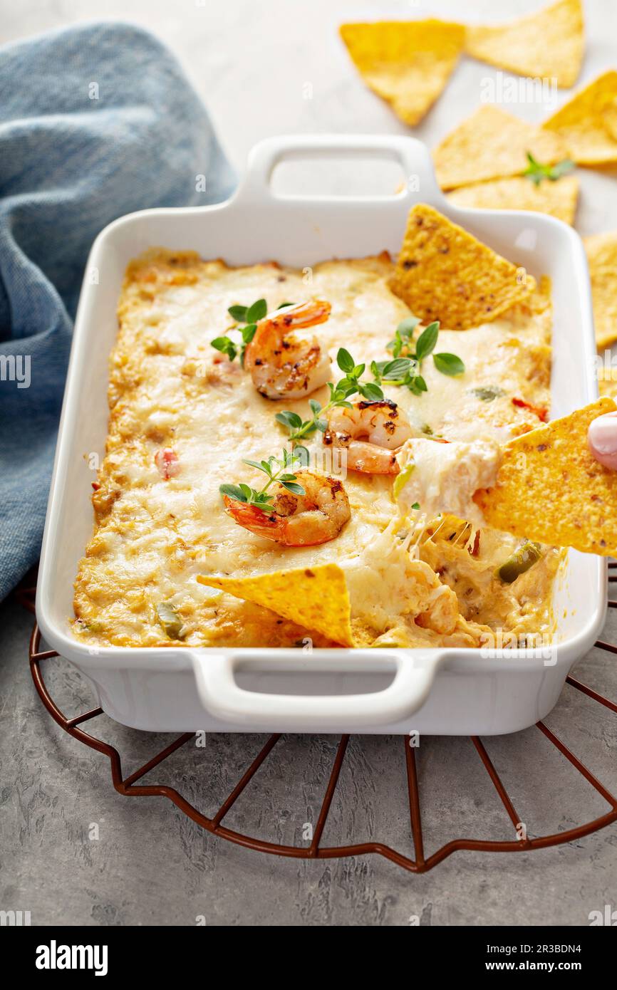 Spicy cheese and shrimp dip with tortilla chips Stock Photo Alamy