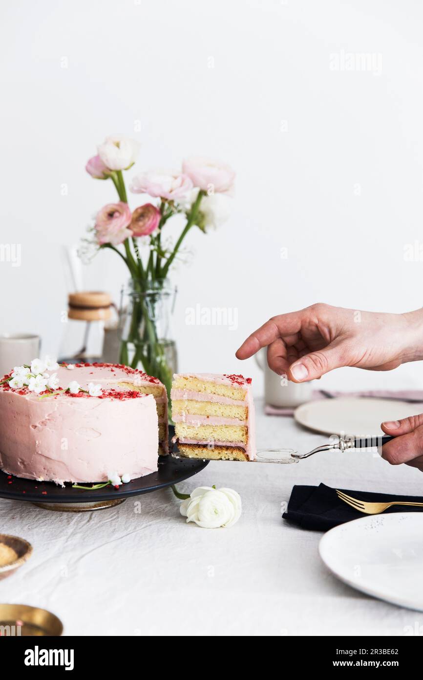 A sliced strawberry cream cake Stock Photo