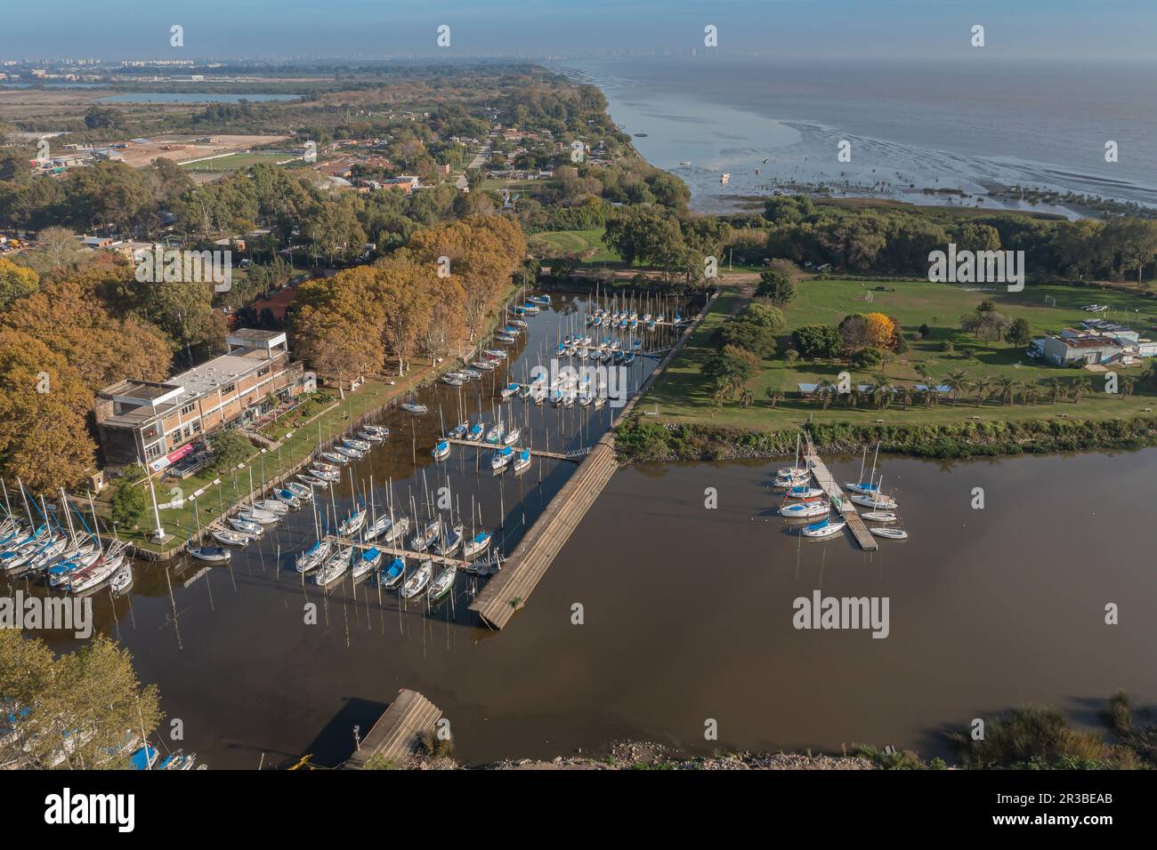 Sailboats docked at a pier on the coast of the Rio de la Plata in the city of Quilmes. Stock Photo