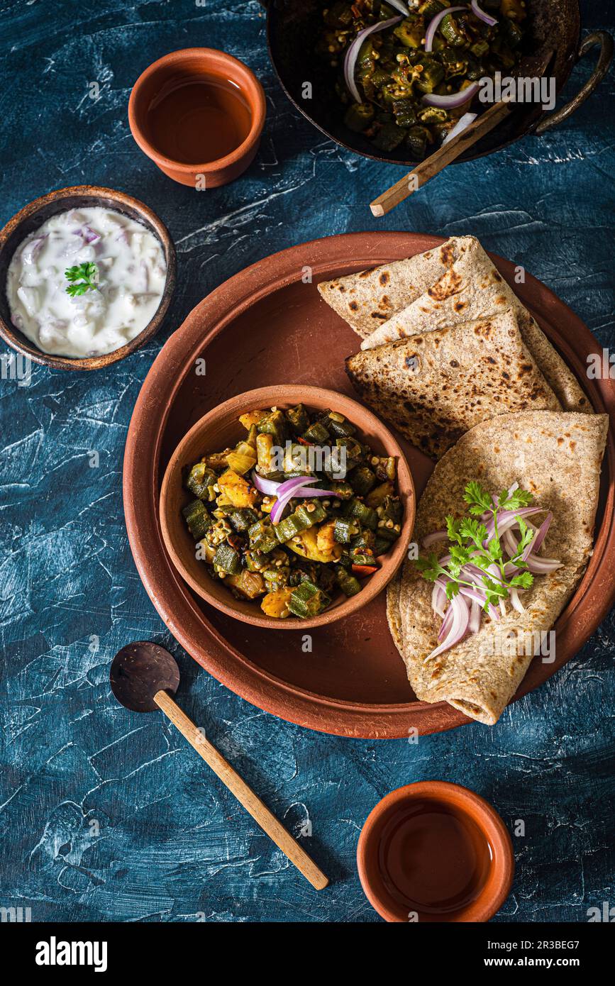Indian okra vegetables with unleavened bread Stock Photo Alamy
