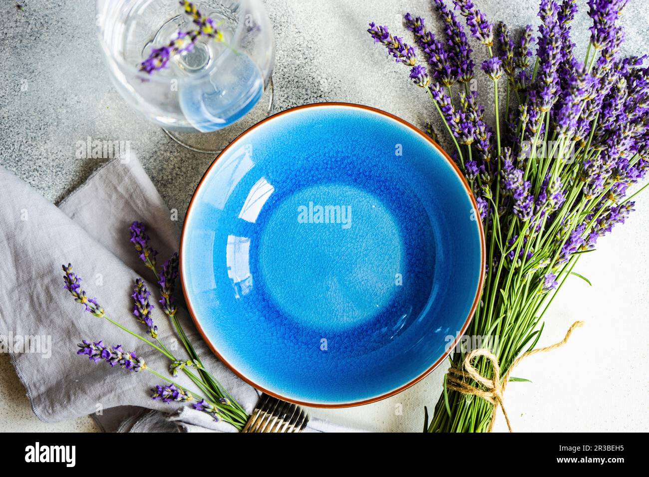Summer Time Table Set With Blue Stoneware And Cutlery Decorated With summer-time-table-set-with-blue-stoneware-and-cutlery-decorated-with