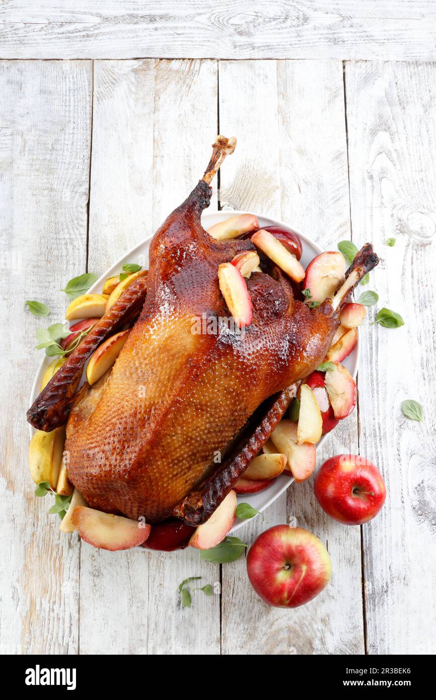 Whole baked goose with apples Stock Photo - Alamy