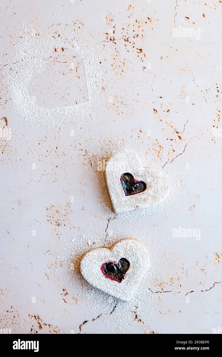 Heart shaped cookies with raspberry jam Stock Photo Alamy