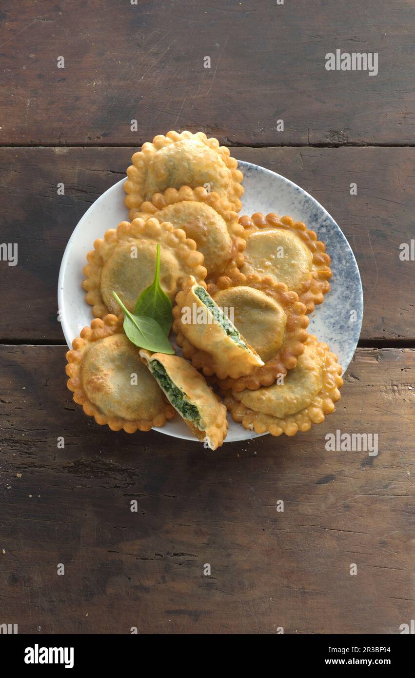 Spinach tirteln (deep-fried pastries from South Tyrol Stock Photo - Alamy