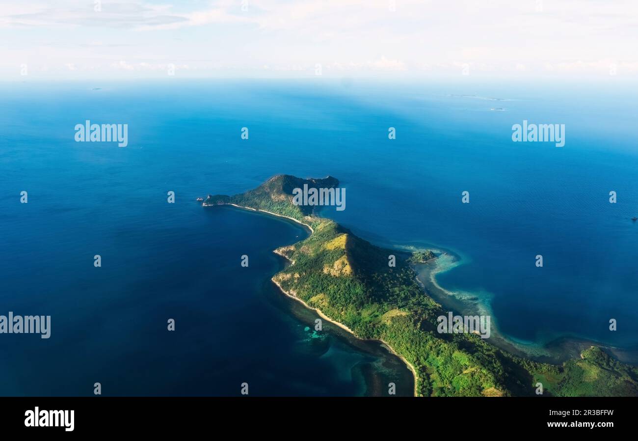 Coron island amidst blue sea in Philippines Stock Photo
