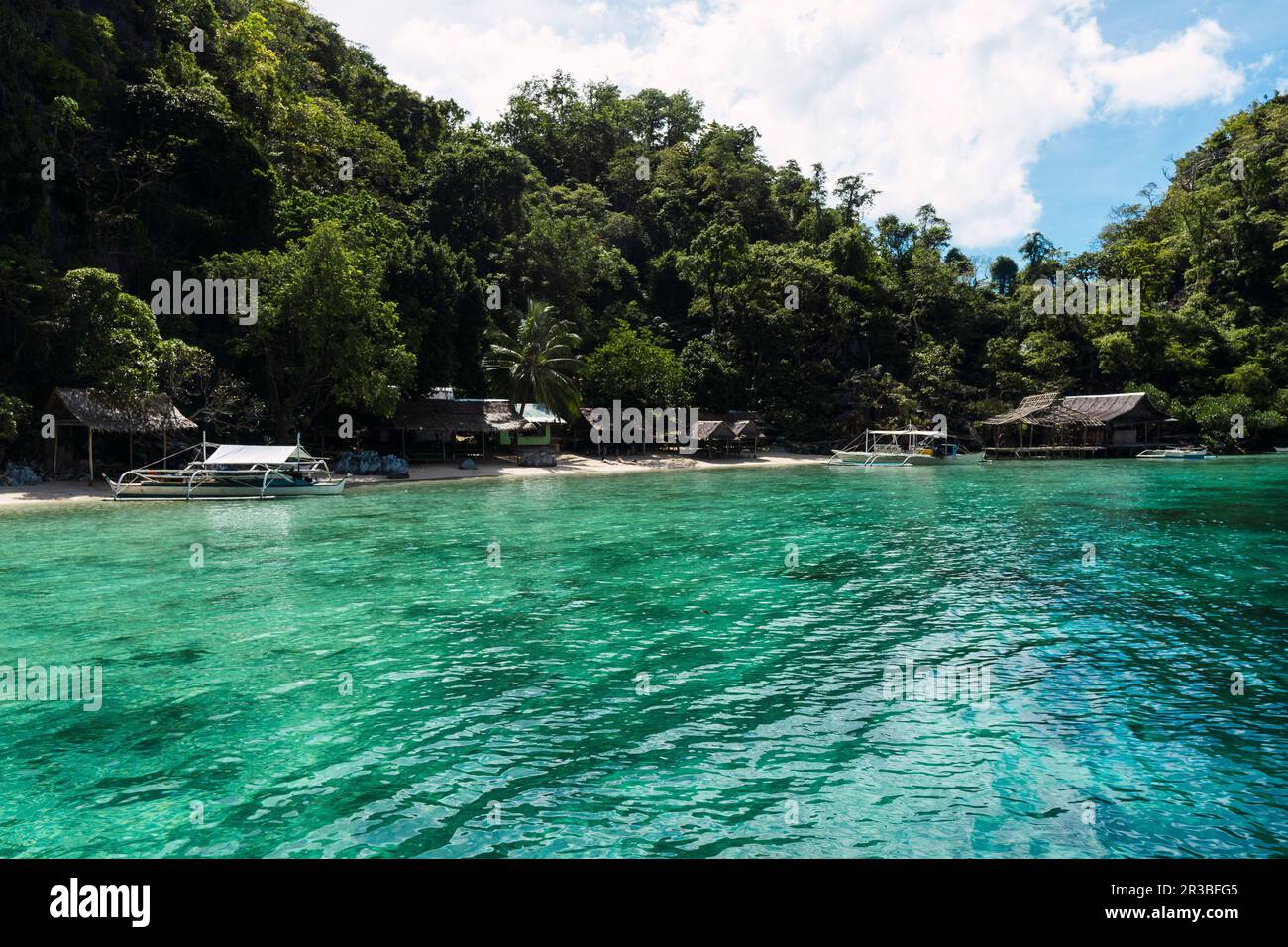 Sea with huts and trees at Coron Island in Philippines Stock Photo