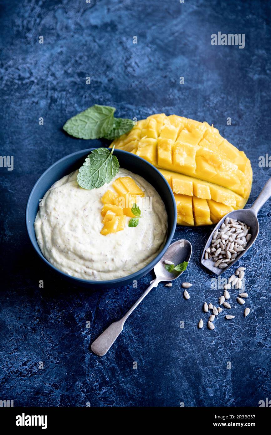 Mango quark with sunflower seeds Stock Photo - Alamy