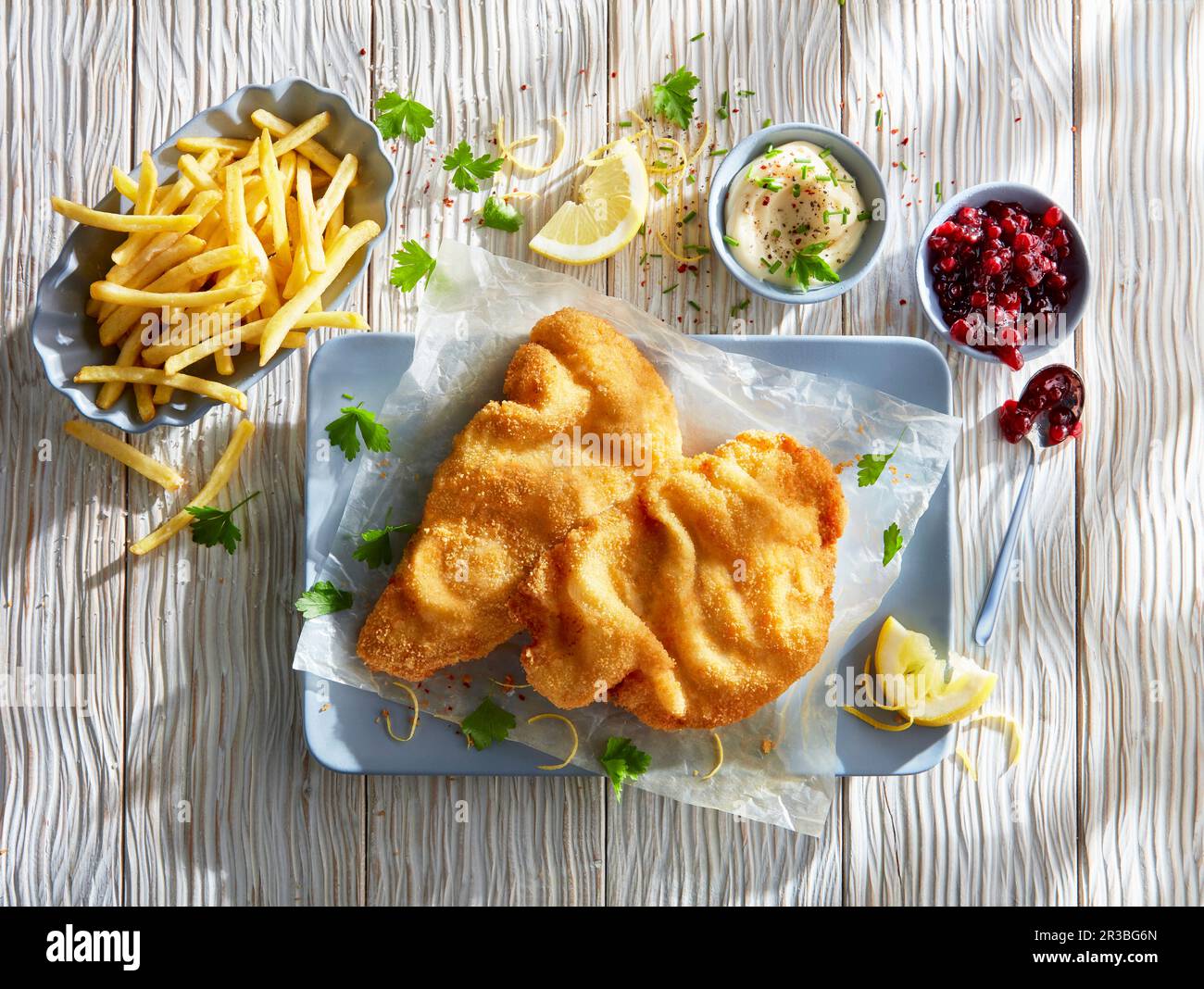 Wiener schnitzel with french fries and dips Stock Photo Alamy