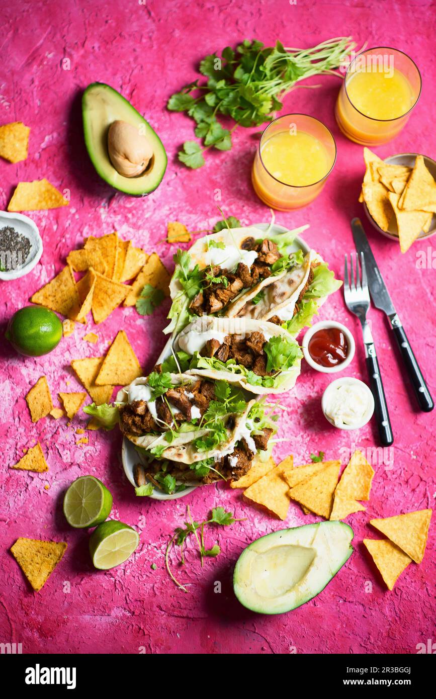 Tacos with spicy beef coriander garlic sauce Stock Photo Alamy