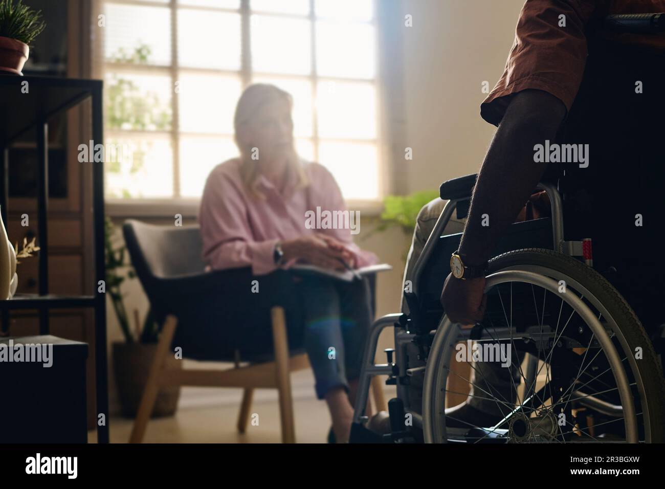 Patient with disability in therapy session with psychologist at office Stock Photo Alamy