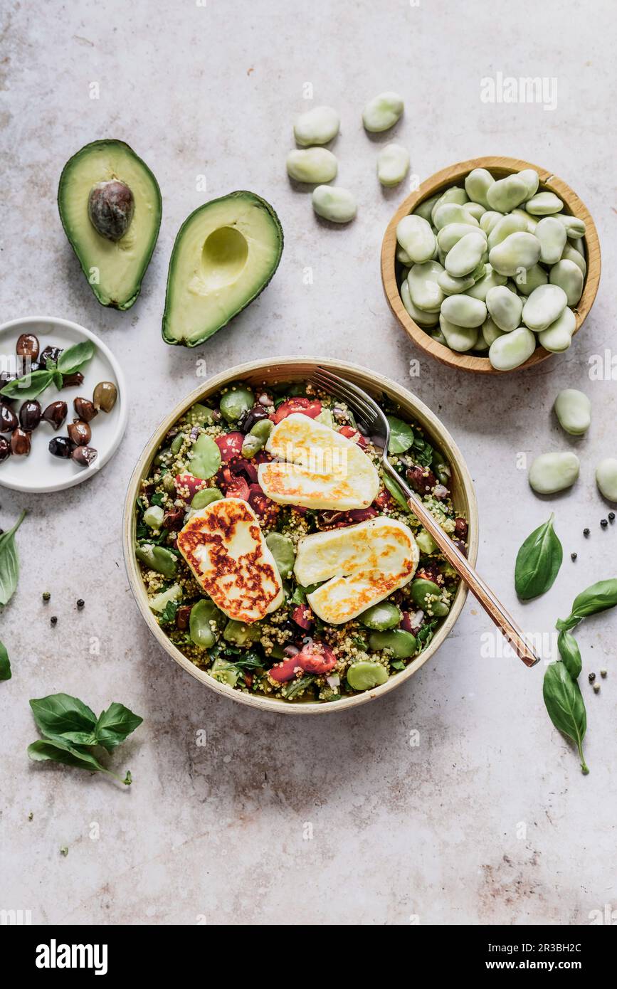 Tabuleh salad with couscous, avocado, tomatoes , broad beans olives and