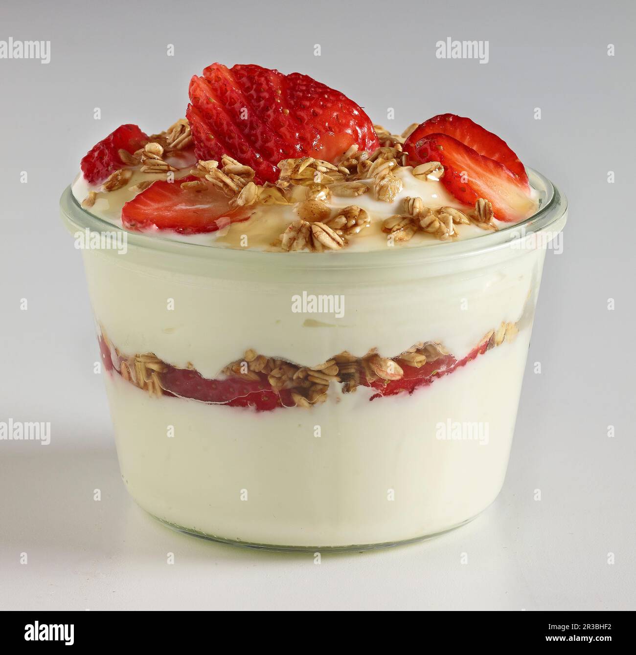 Strawberry yoghurt with granola and honey Stock Photo Alamy
