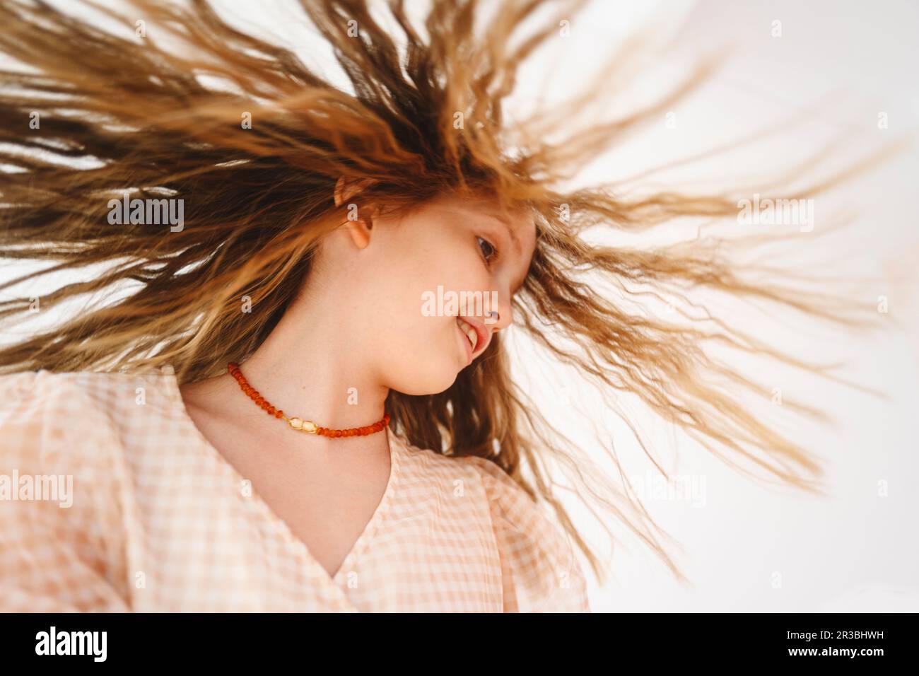 Blond girl with tousled hair Stock Photo