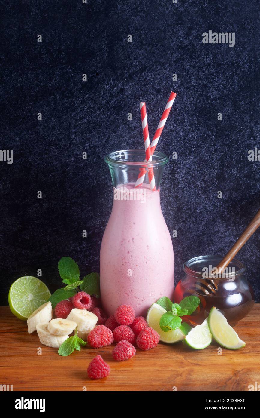 A raspberry smoothie in a glass bottle Stock Photo