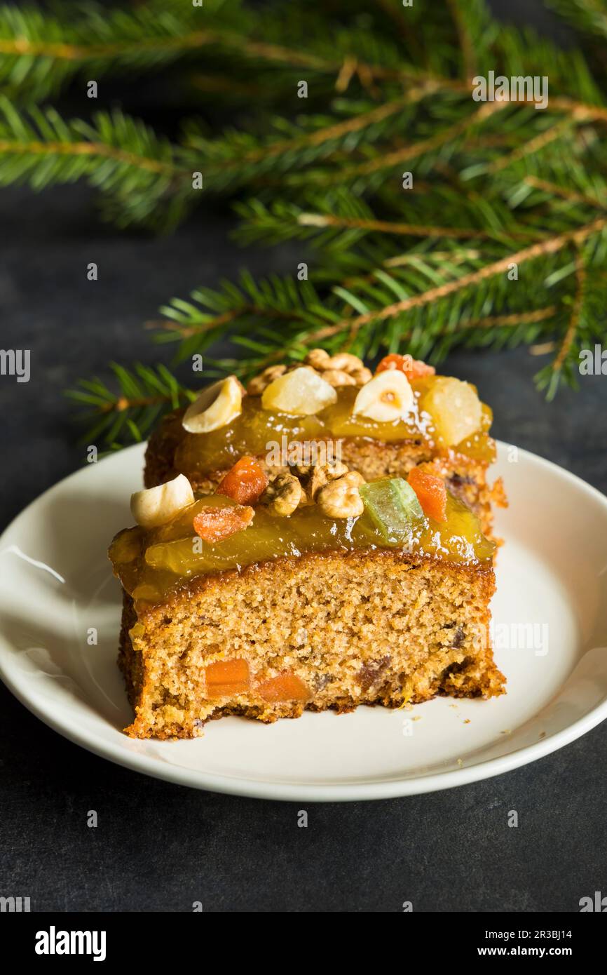 Christmas fruit cake with nuts, spices and sweet fruits Stock Photo