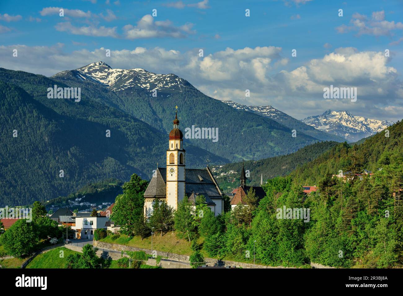 Austria, Tyrol, Tarrenz, Mountain village in summer with church in foreground Stock Photo