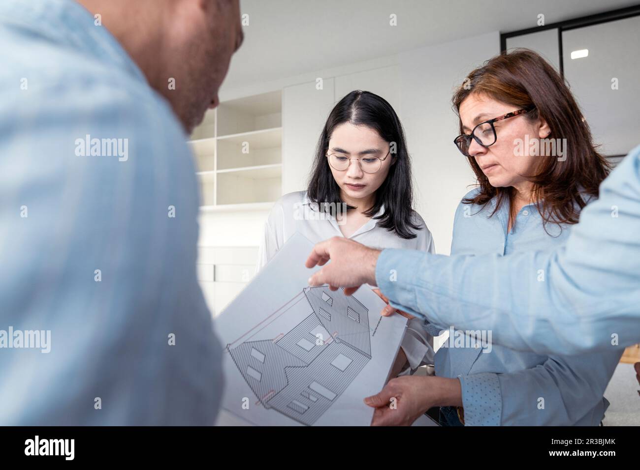 Business people working together on an architectural project in office Stock Photo